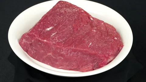Fresh Raw Beef Steak Rotating On White Platee Stock Footage 343258461