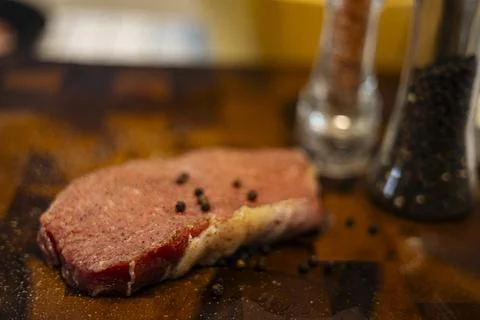 Fresh Raw Beef Steak With Rub On The Wood Board Stock Photos