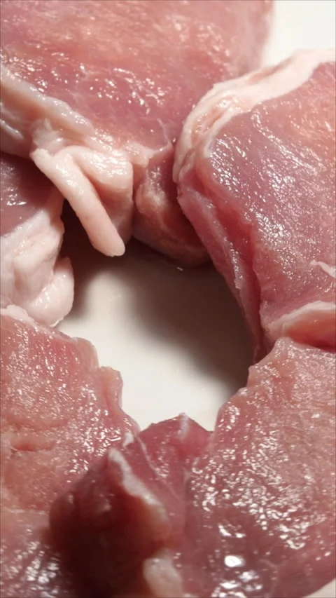 Fresh Raw Beef on White Plate. Rotation. Vertical. Stock Footage 276316990