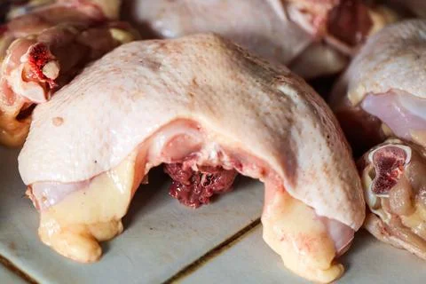 Fresh Raw Chicken Back Carcass Displayed at Traditional Market Stall, Close.. Stock Photos