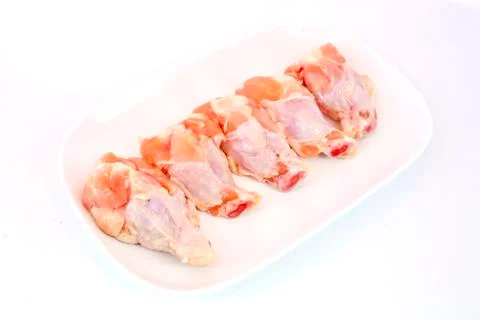 Fresh raw chicken wings isolate on white background ready to be grilled Stock Photos
