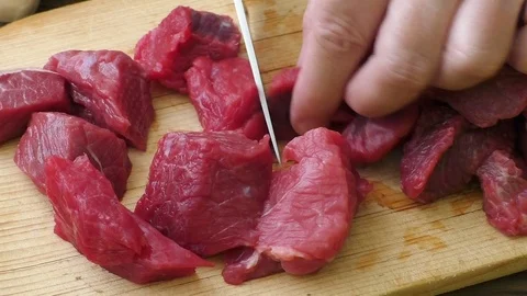 Fresh raw chopped beef. Cooking goulash with beef meat. Stock Footage 78228063