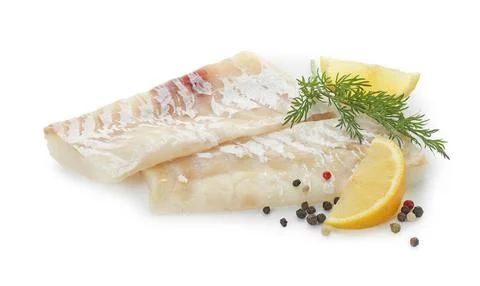Fresh raw cod fillets with peppercorns, dill and lemon isolated on white Stock Photos