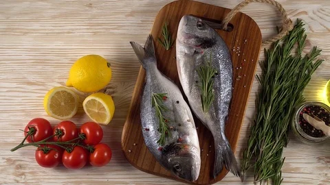 Fresh raw dorado and on table Stock Footage 75168025