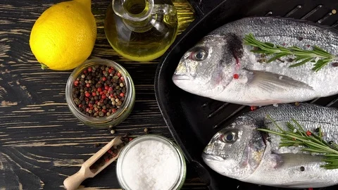 Fresh raw dorado and on table Stock Footage 75186969