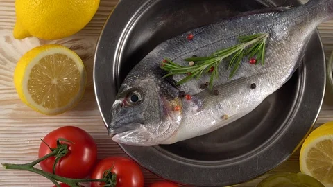 Fresh raw dorado and on table Stock Footage 75636861