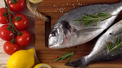 Fresh raw dorado and on table Stock Footage 75637353