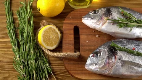 Fresh raw dorado and on table Stock Footage 75754152
