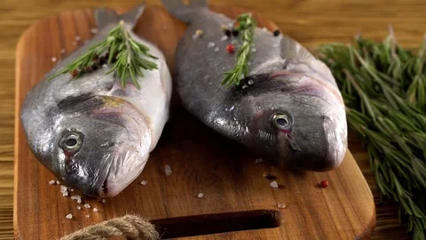Fresh raw dorado and on table Stock Footage 76652212