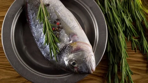 Fresh raw dorado and on table Stock Footage 76680788