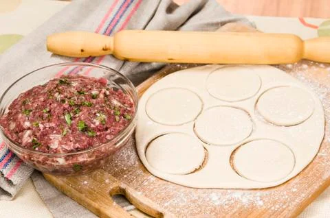 Fresh raw dough and beef forcemeat Stock Photos
