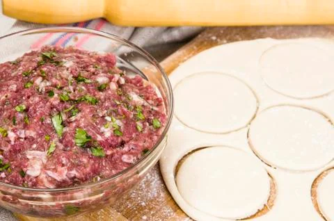 Fresh raw dough and beef forcemeat Stock Photos