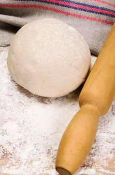 Fresh raw dough and rolling pin Stock Photos