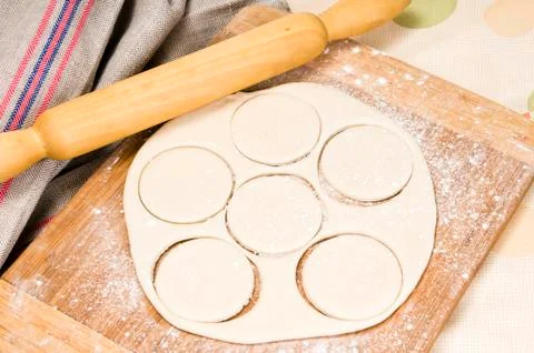 Fresh raw dough and rolling pin Stock Photos