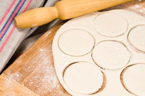 Fresh raw dough and rolling pin Stock Photos