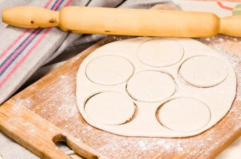 Fresh raw dough and rolling pin Stock Photos