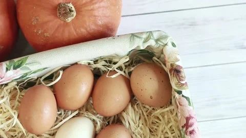 Fresh raw eggs in a wicker basket, top view. Natural, healthy farm food Stock Footage 233602027