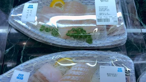 Fresh raw fish neatly packaged for convenience at the market. Premium seafood Stock-Footage 301991835