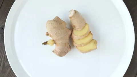 Fresh raw ginger root, partially sliced. Video stock 328502280