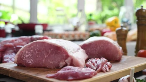 Fresh raw meat on a cutting board in the kitchen Stock Footage 154599659