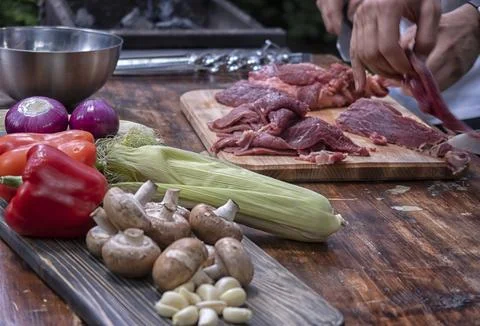 Fresh raw meat on kitchen table Stock Photos