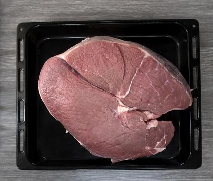 Fresh raw meat on kitchen table Stock Photos