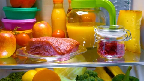 Fresh raw meat on a shelf open refrigerator Stock Footage 92690746