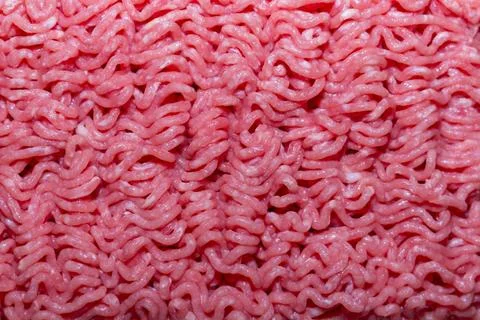 Fresh raw minced meat texture with wavy patterns of ground beef for cooking Stock Photos