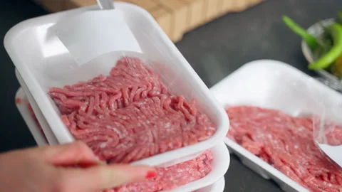 Fresh raw mixed beef and veal mince in white plastic containers, food and cook Stock-Footage 211407528