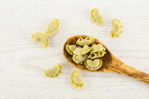 Fresh raw paste Creste di Gallo on grey wood Foto stock