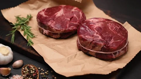 Fresh raw pieces of beef meat on a cutting board Stock Footage 153008892