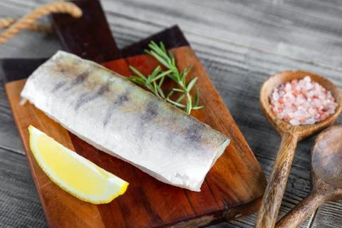 Fresh raw pike perch fish fillet on cutting board Stock Photos