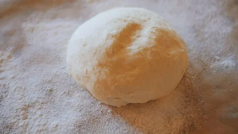 Fresh raw pizza or bread dough is on the table Stock Footage 95802816