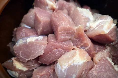 Fresh Raw Pork Cubes for Culinary Preparation in Home Cooking and Recipes Stockfoto's