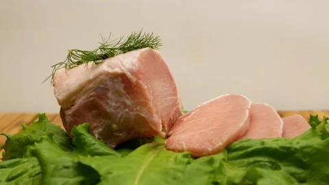 Fresh raw pork meat close-up. Preparing for frying. Pork steak. Rotation. The Stock Footage 201602458
