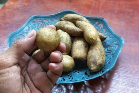 Fresh raw potatoes stack Stock Photos