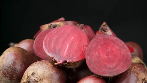 Fresh raw red beets beetroot, whole and halved Stock Footage 314575791