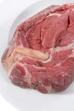 Fresh raw red ribeye beef steak on big white plate Stock Photos