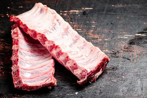Fresh raw ribs on the table. Stock Photos