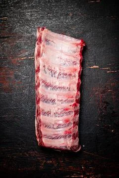 Fresh raw ribs on the table. Stock Photos