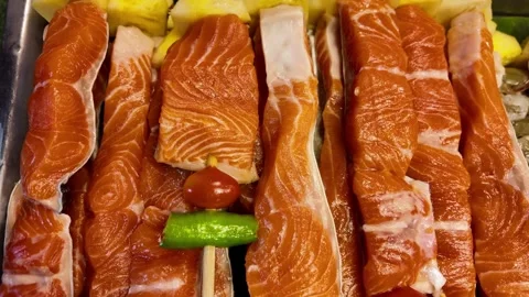 Fresh Raw Salmon Fillets Displayed at Seafood Market Counter 스톡 동영상 337227597