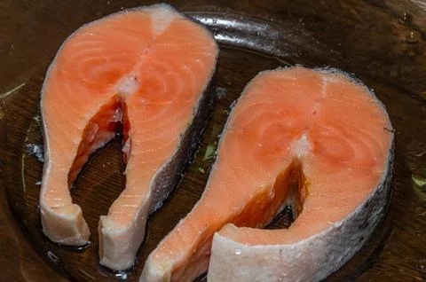 Fresh raw salmon fish steaks on a plate Stock Photos