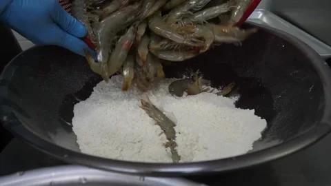 Fresh Raw Shrimp Piling into Metal Bowl in Commercial Kitchen Video stock 343027252