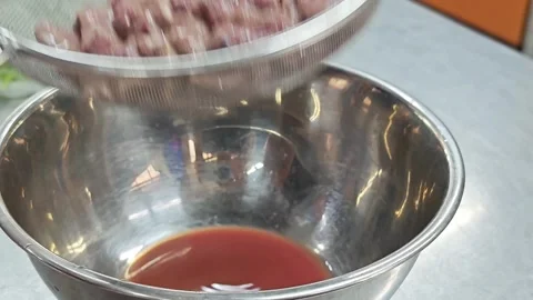 Fresh raw sliced pork liver in steel strainer. Stock Footage 342030376