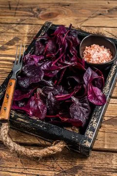 Fresh raw Swiss Ruby or red chard salad Leafs in a wooden tray. wooden Stock Photos