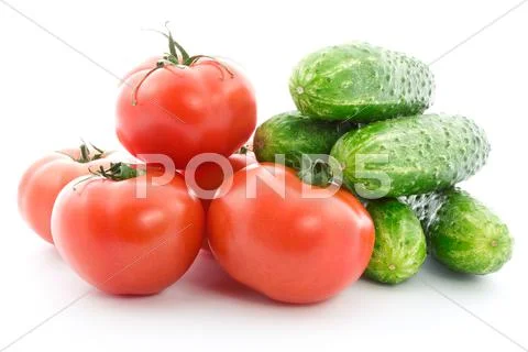 Fresh raw tomatoes and cucumbers Stock Photos