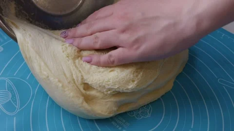 Fresh Raw Yeast Dough Being Placed on Blue Silicone Baking Mat Stock Footage 334119378