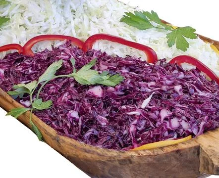 Fresh red and white cabbage salad garnish with red pepper and parsley 库存照片