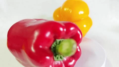 Fresh red and yellow bell peppers isolated on white background. Stock Footage 340938244
