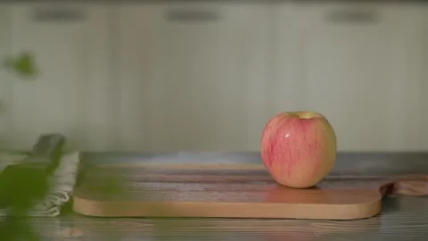 Fresh Red Apple Appearing on Table Stock Footage 344778628